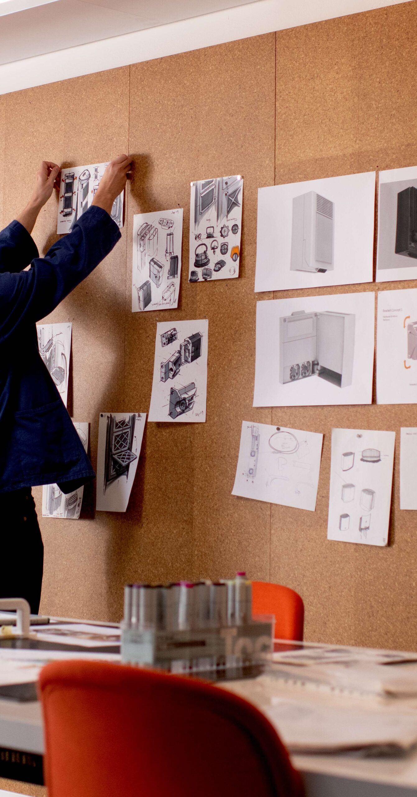 Design work pinned to a studio wall